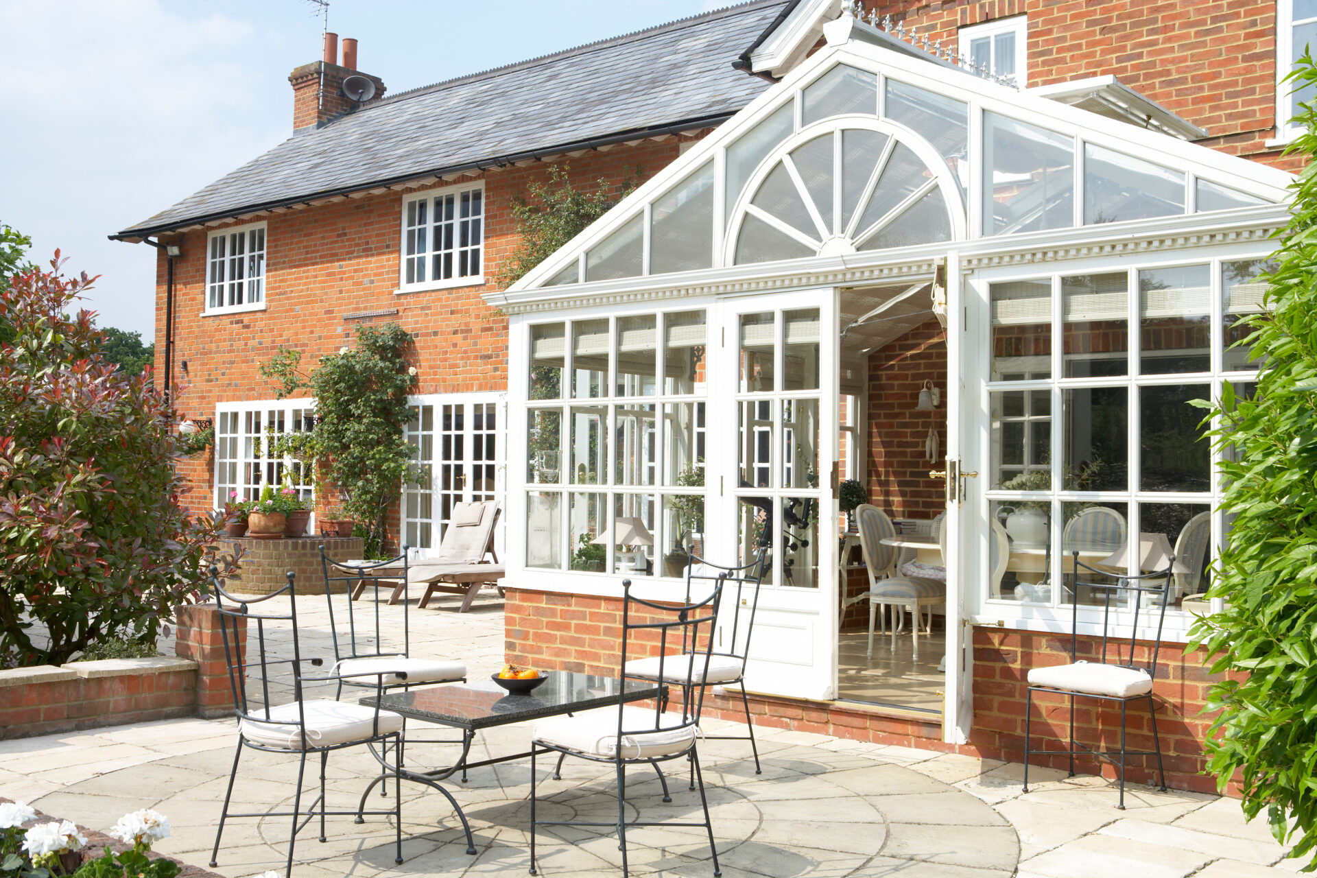 Exterior Of House With Conservatory And Patio