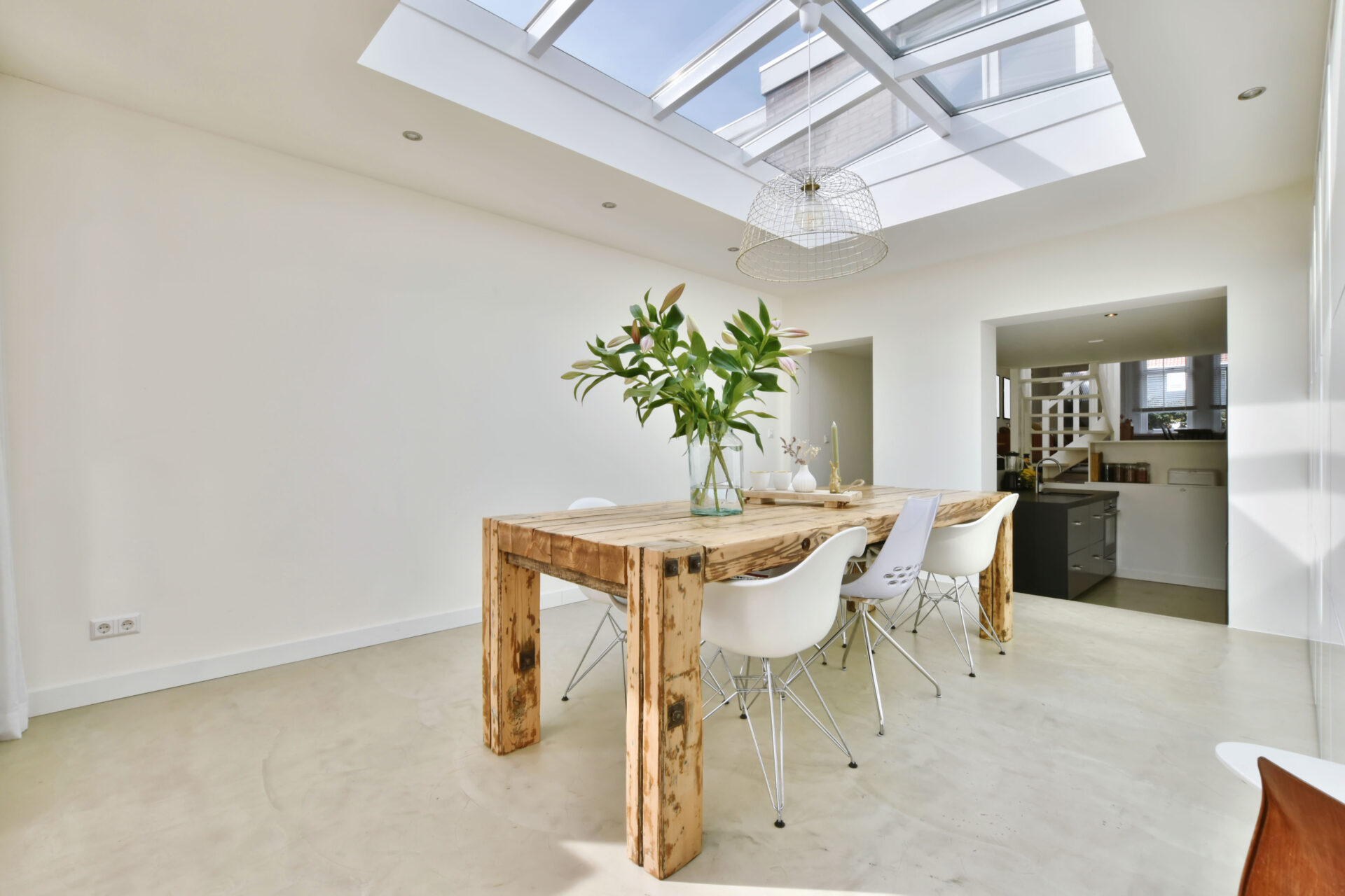 Elite dining area with glass ceiling and white walls